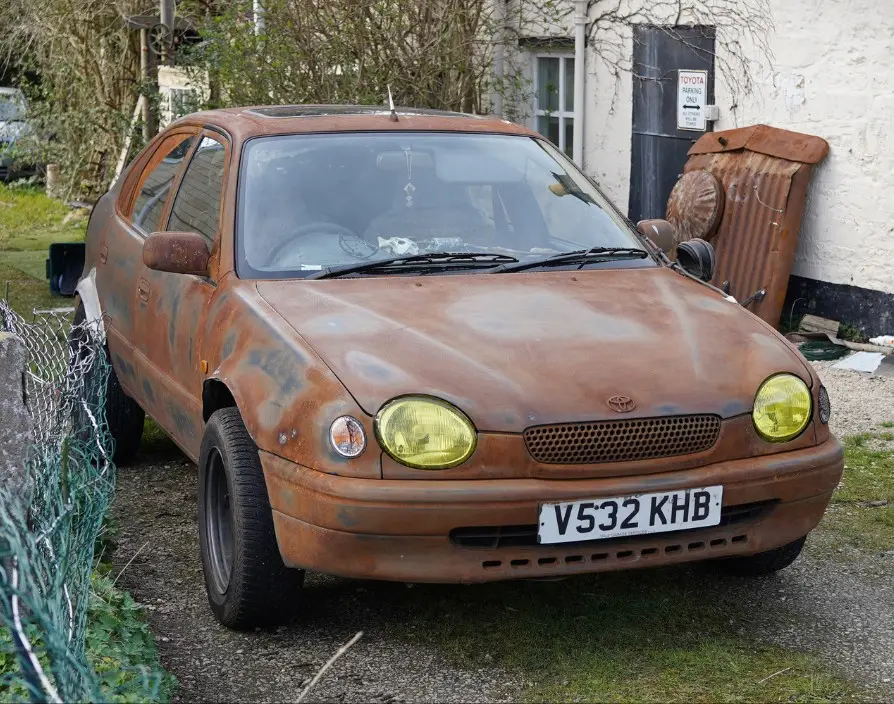 AI The spoiler wont fix your rusty car.webp
