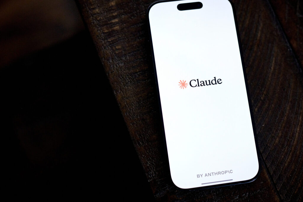 Anthropic Claude logo on a smartphone Bloomberg scaled