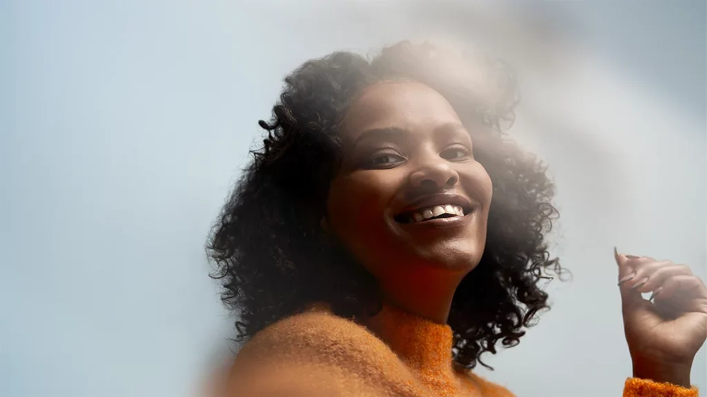 MSFT A smiling woman in control of her daily life after using AI automation for setting goals