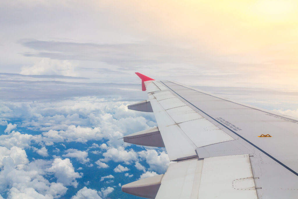airplane flying clouds