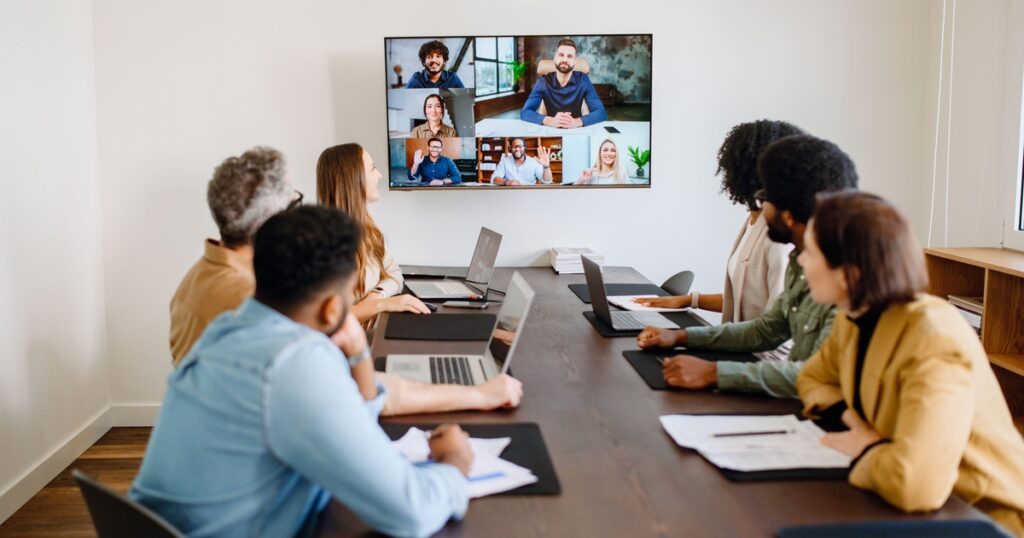 Enhancing Operational Efficiency Through Comprehensive Automation Tutorials 2 hybrid meeting taking place at the office