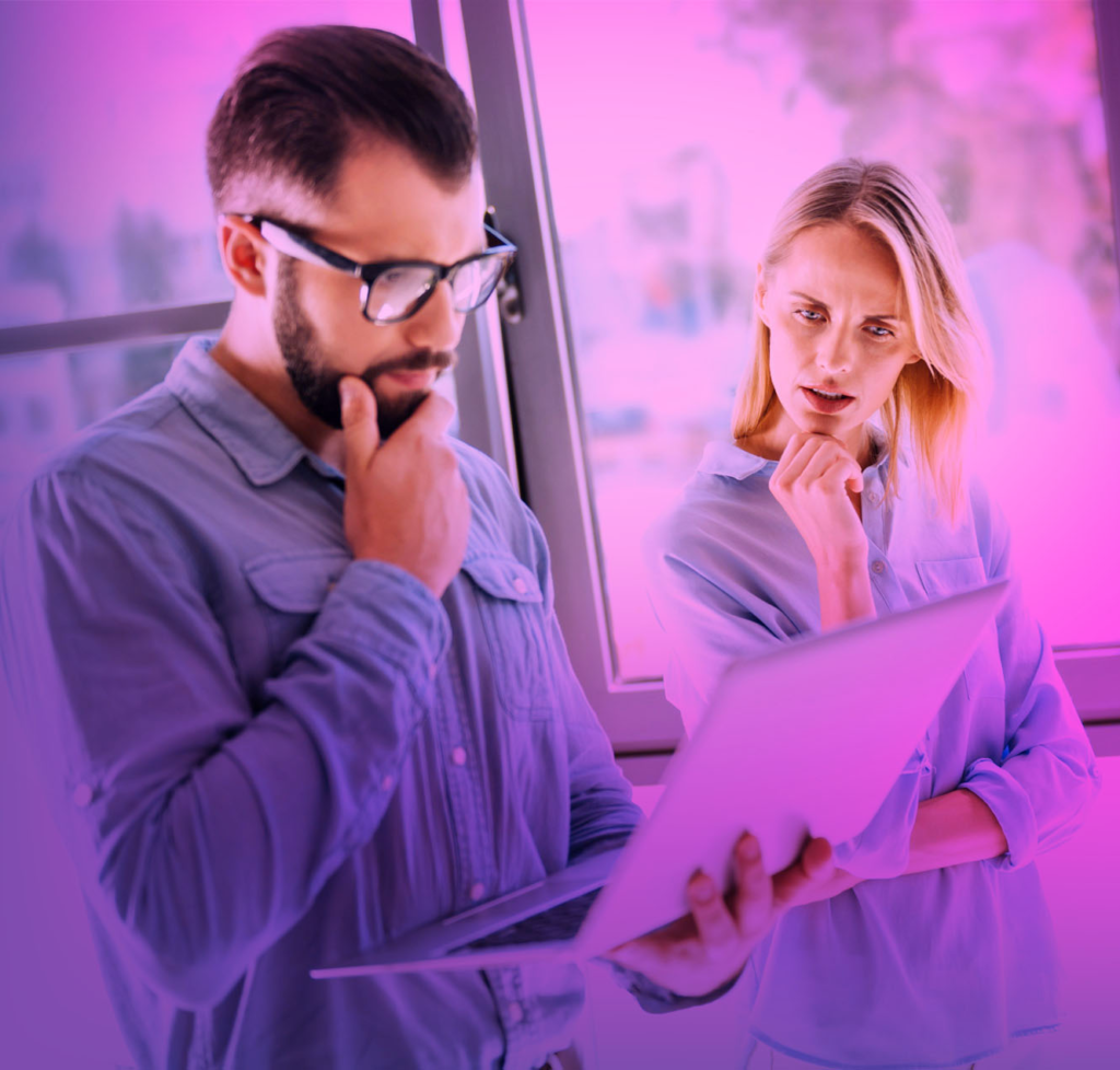 Enhancing Efficiency: Analyzing the Impact of Automation Tutorials on Workforce Productivity 9 two people looking at laptop card