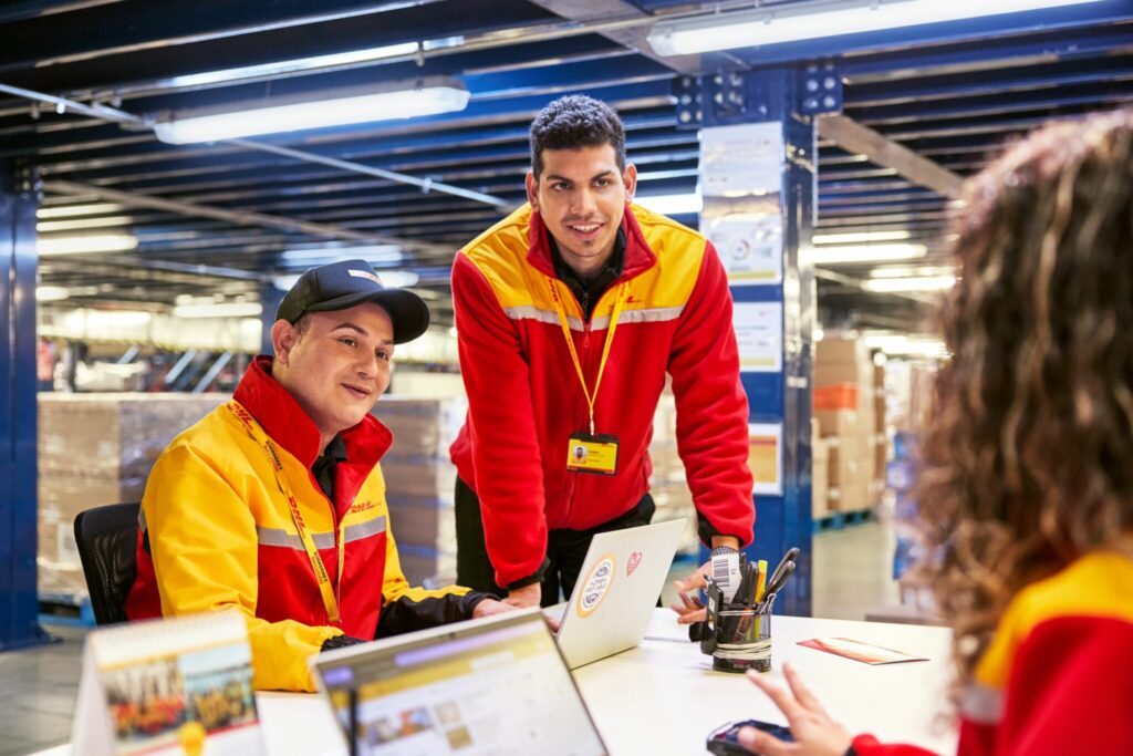Enhancing Efficiency Through FlowMind AI: A Guide to Automation Tutorials 2 dhl employees in warehouse
