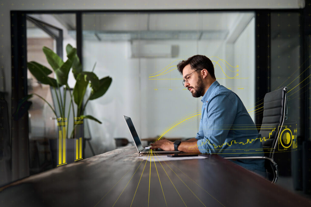 ey ai professional using laptop working in office