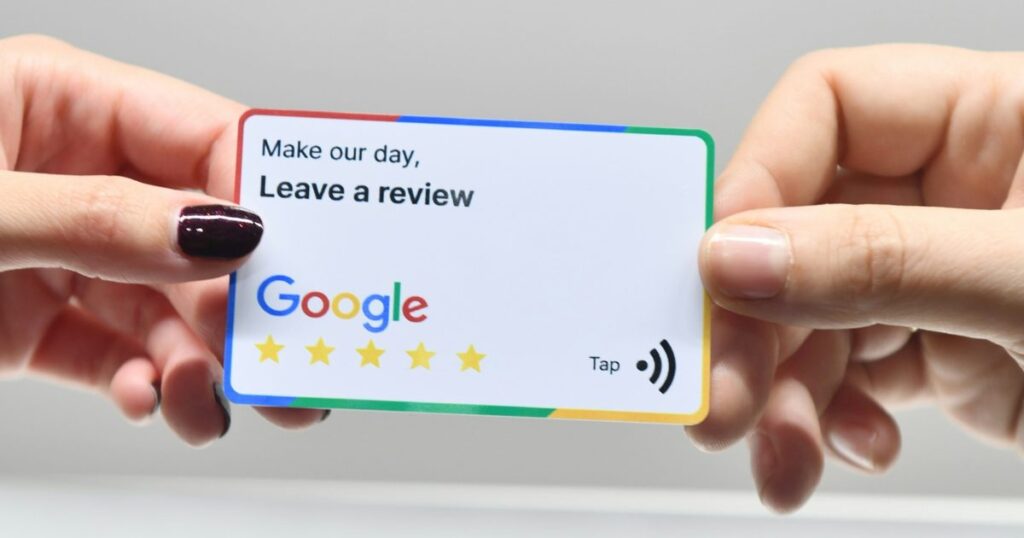 hand holding a card asking for review